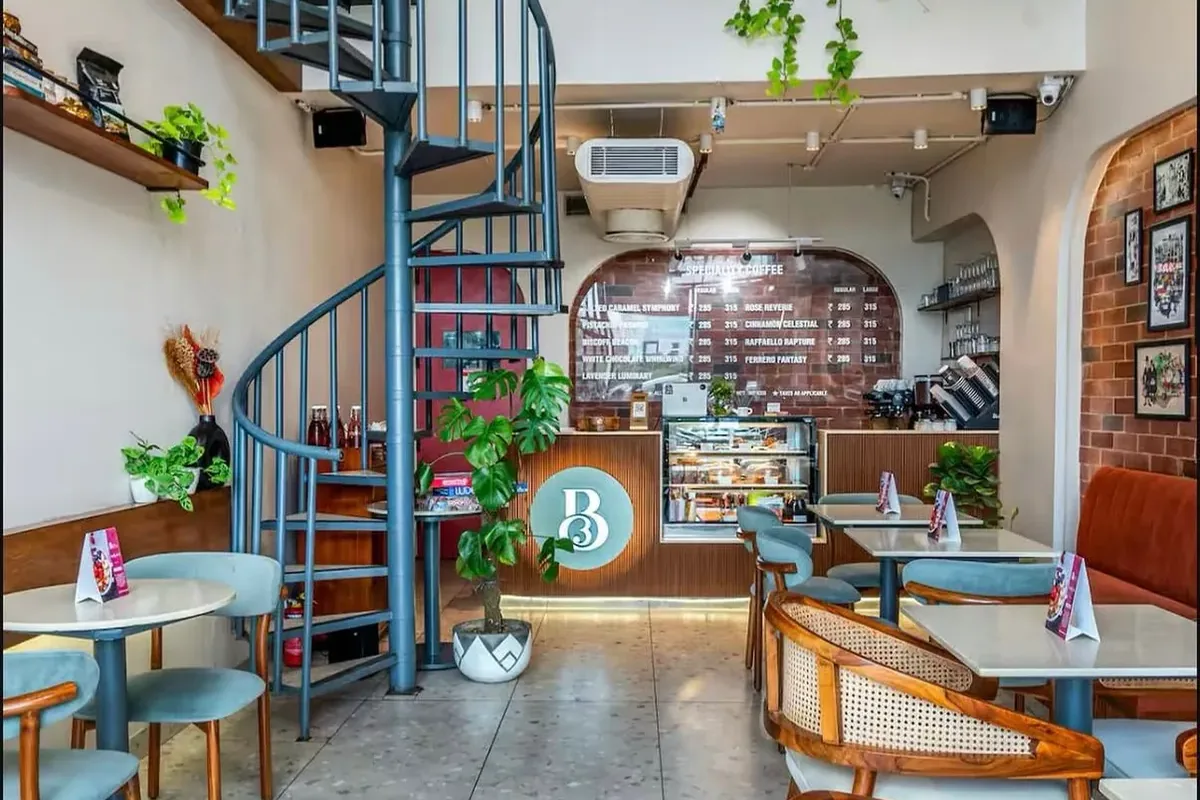 The Bean Brew cafe in Gurgaon, looking up the spiral staircase to the mezzanine floor.